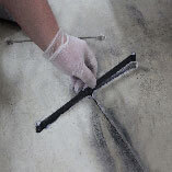 Excess epoxy is grinned away, ensuring a smooth finish.