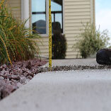 Uneven sidewalk before PolyLift concrete lifting.