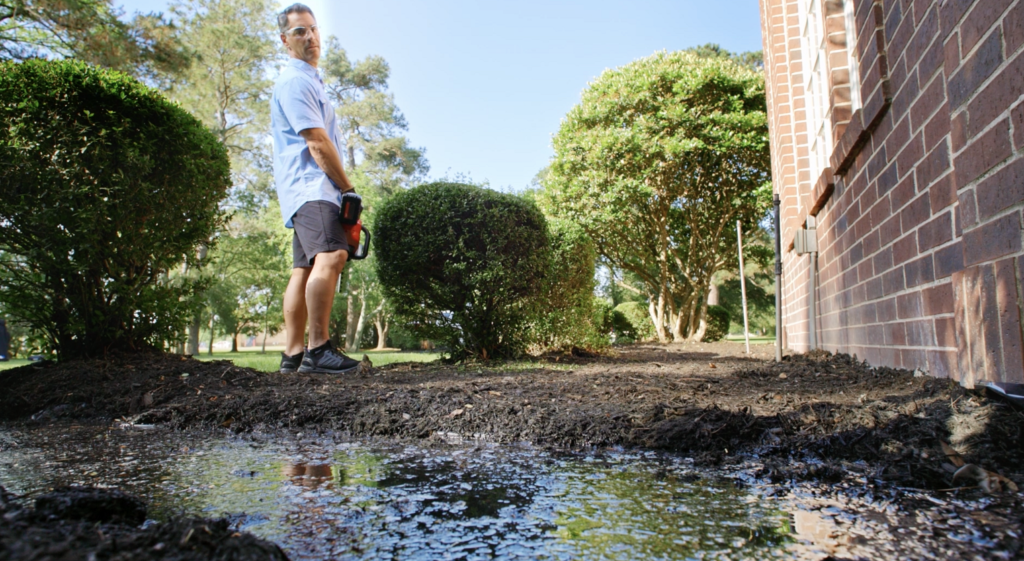 wet lawn due to poor drainage near home foundation