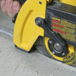 Using a tuck point grinder, a small cut is made across the crack to accommodate our Crack Lock technology.